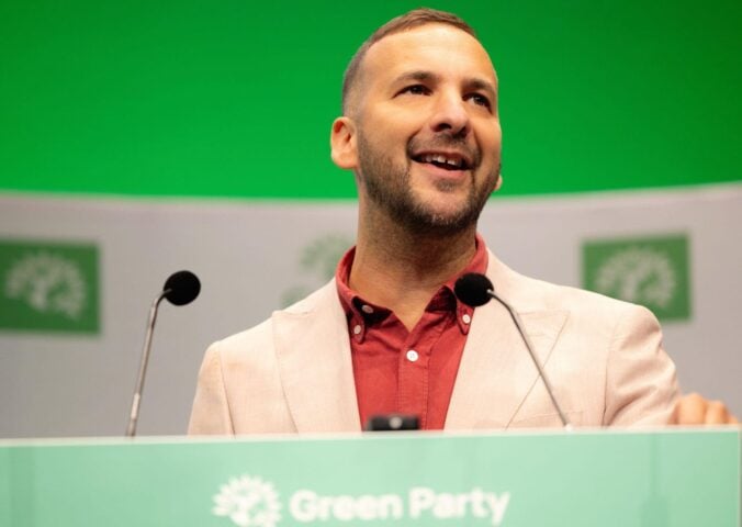 Photo shows Zack Polanski, the deputy leader of the Green Party, at a speaking event